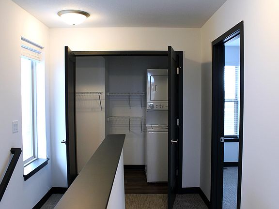 Equipped laundry closet with storage.