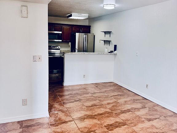 Main living area with dining and kitchen.