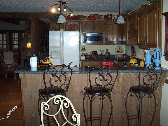 Kitchen has been recently renovated & has breakfast bar, room.