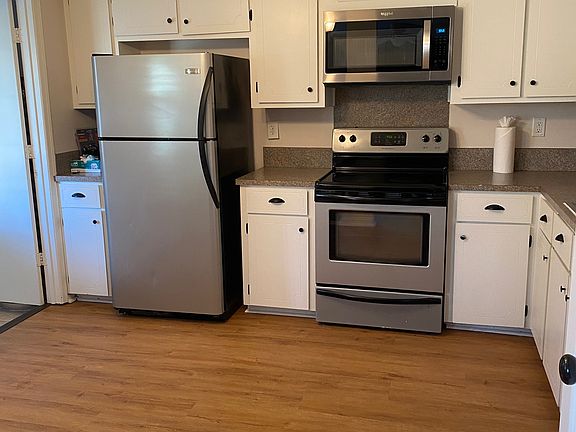 Kitchen with door into separate laundry room and back porch