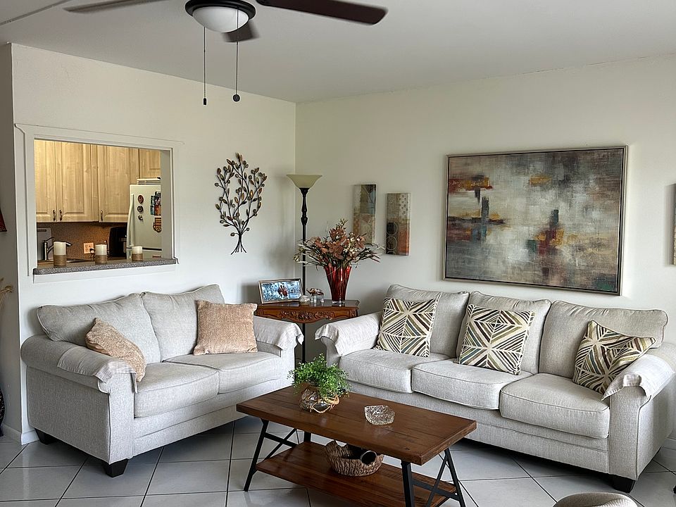 Living Room with a view of kitchen pass-through window