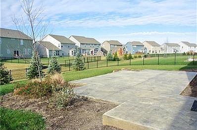 Seller added this 500 square foot stamped concrete fence, custom landscaping complete with boulders and a fully fenced back yard.