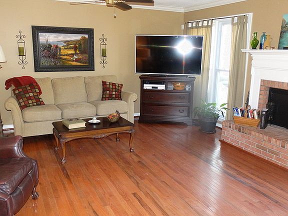 Living Room : New hardwood flooring, french doors leading onto upper deck