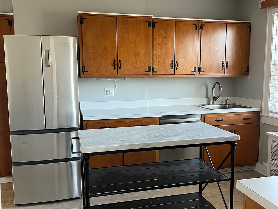 Stainless steel appliances and movable center island