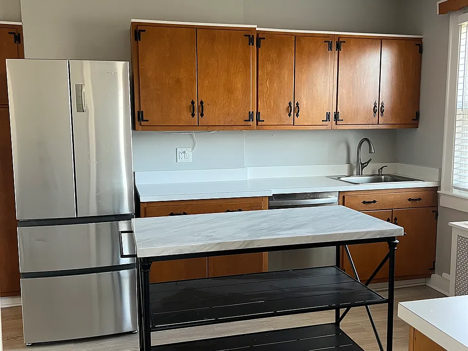 Stainless steel appliances and movable center island