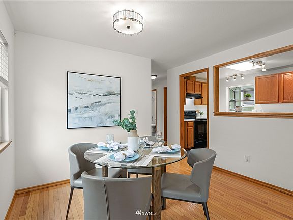 The dining area has room for your guests and looks into the kitchen and living room.