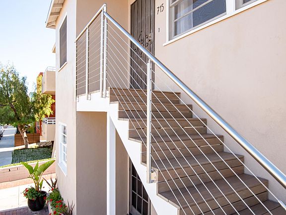 715 is the upper unit in the front building. New stairs and railings.