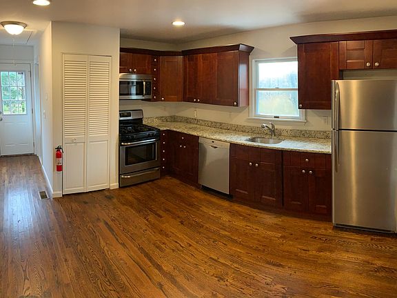 Large eat-in kitchen, upgraded, with granite counters, wood cabinets, and stainless steel appliances