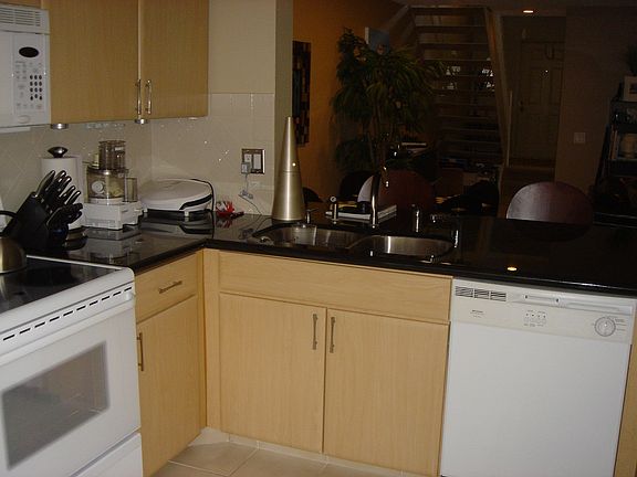Kitchen w/ Granite Counters & Wood Cabinets