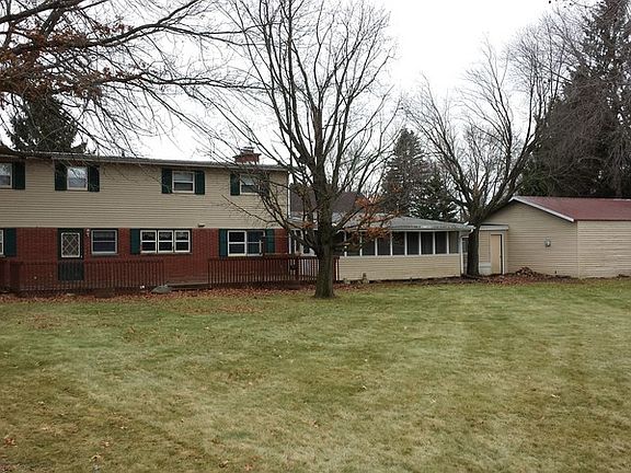 Back of Home : Mature trees and spacious yard (0.92 acres).