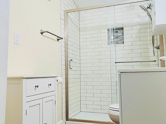 Modern bathroom, new flooring & fixtures.