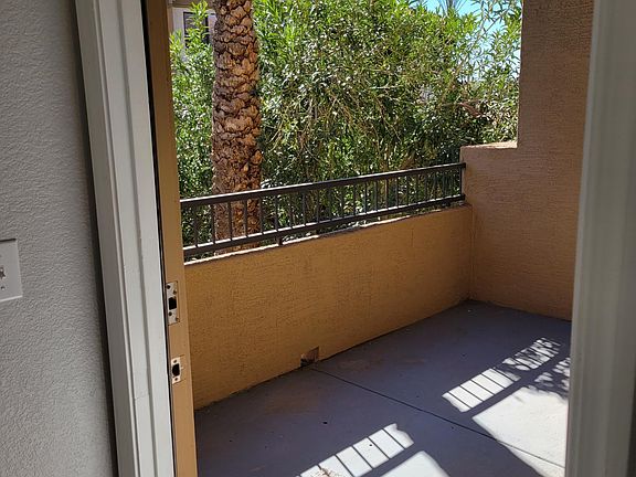Balcony with courtyard views and side views of pool