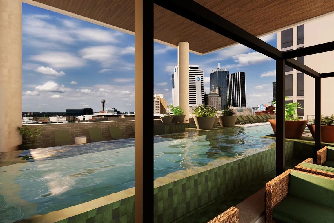 Resort-style pool located on the 7th floor with spacious sundeck, cabanas, in-pool lounges, and Downtown Dallas views.