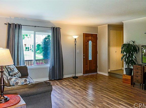 Living room. You have a view of the Green belt out your front window