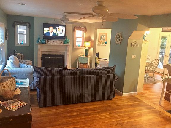 Living room with ceiling fans.