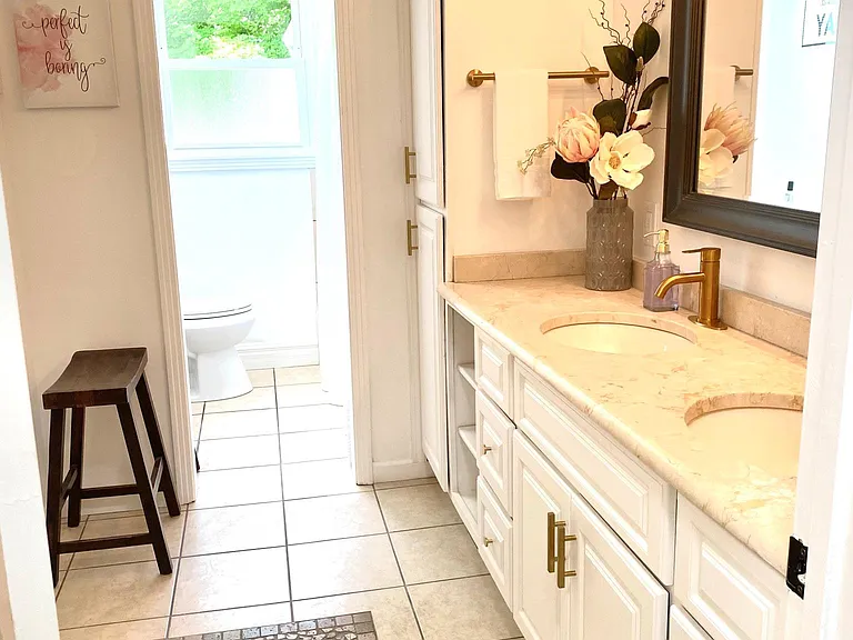 Guest Full Bathroom with dual vanity.