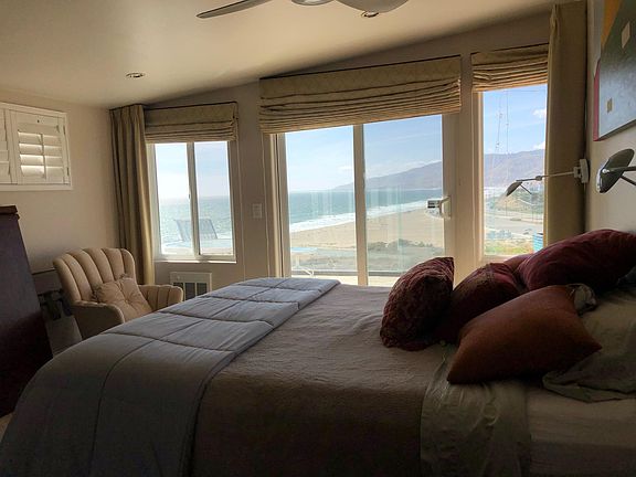 Oceanview bedroom #3 with ensuite and sliding door out to patio.