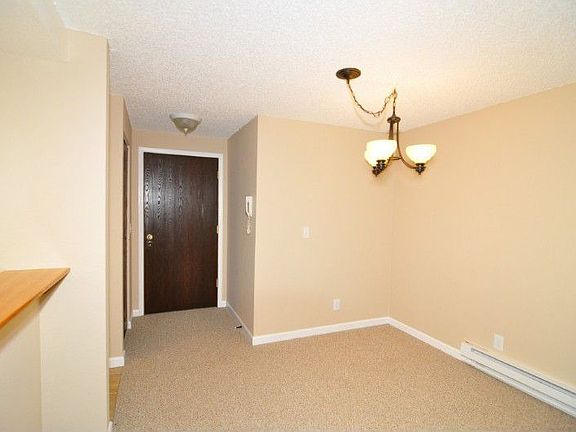 Enter to the dining room. The kitchen is to the left here.