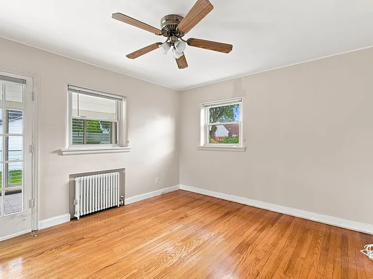 downstairs bedroom with access to backyard and sunroom