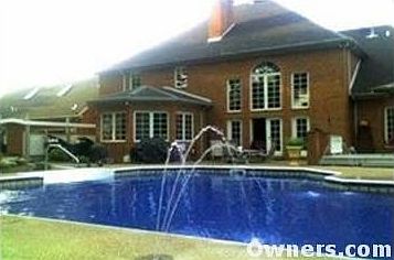 backyard pool with fountains
