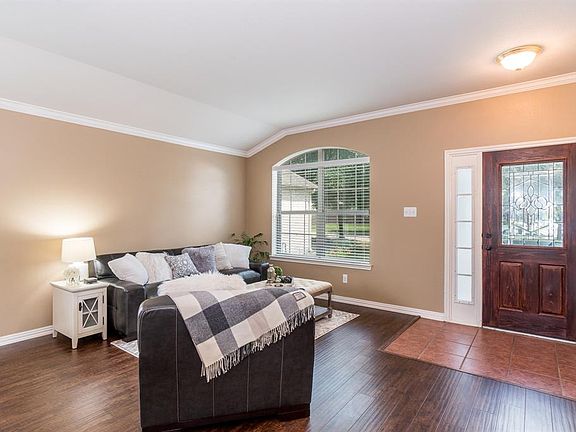 Tile entryway. Bright and airy formal living room.