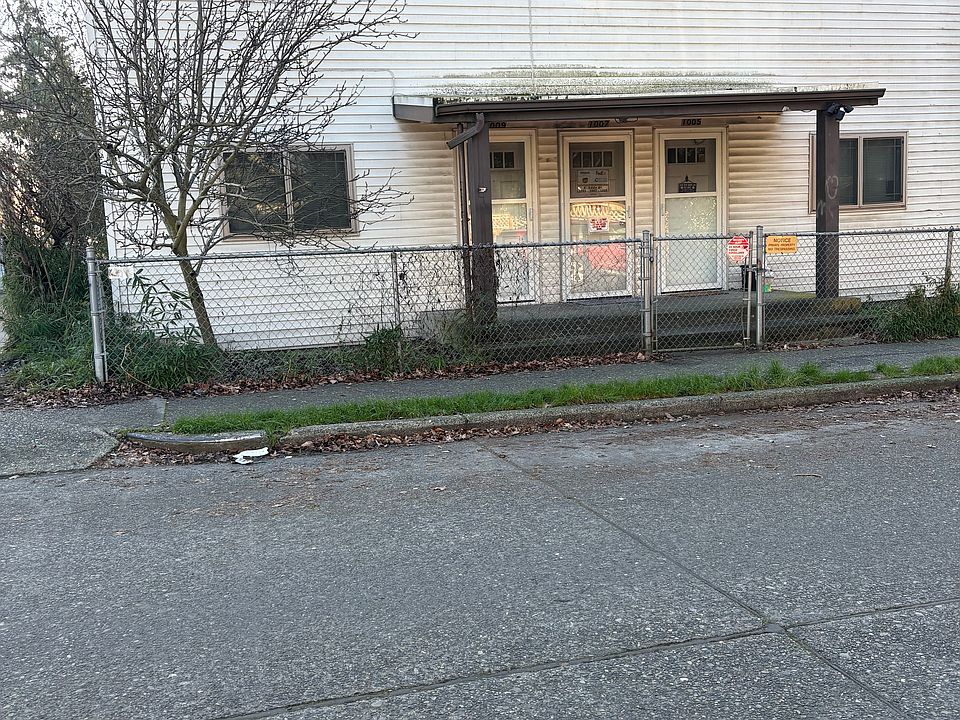 Exterior of 4 Plex apartment. Unit front door is farthest to the left.