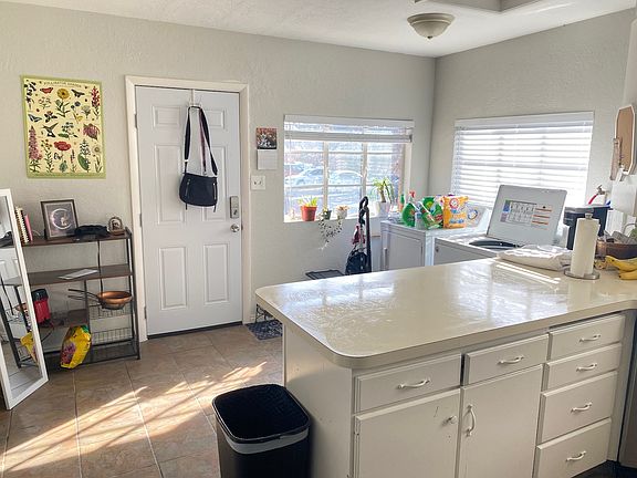 Kitchen entryway with washer / dryer