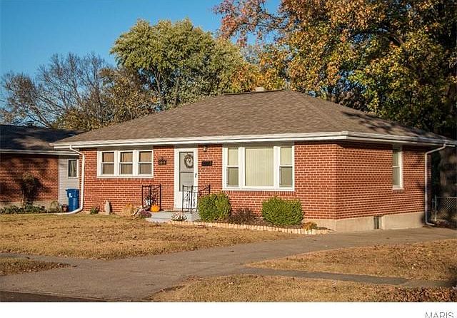 Newer architectural shingle roof, newer soffits and fascia and newer windows in front of home.