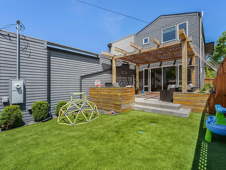 Backyard w/ artificial turf installed