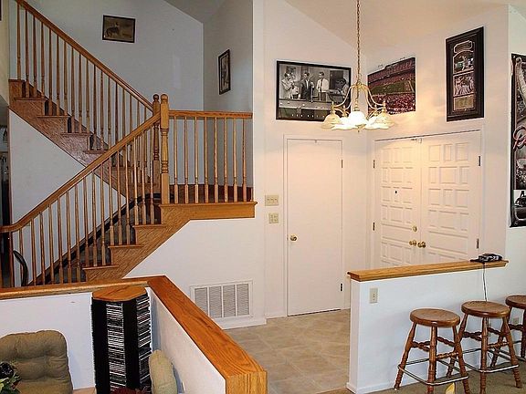 Front door enters to the Family Room and stairway.