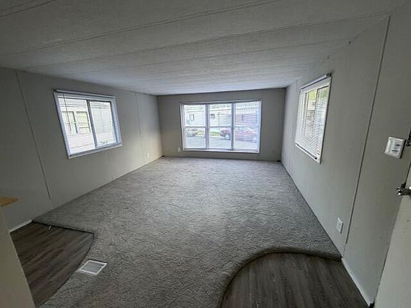 2nd image of 4747 W River Dr NE Lot 13