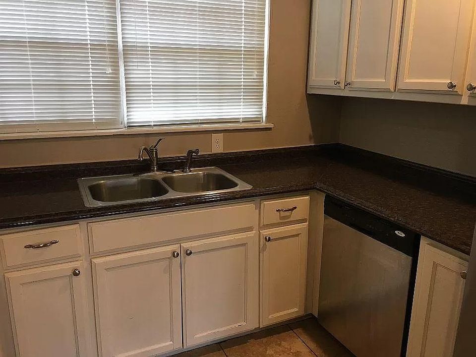 Kitchen Sink Area with Large Window for extra natural light. Dishwasher included.
