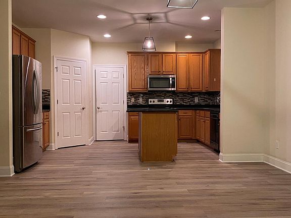 kitchen connected with breakfast area