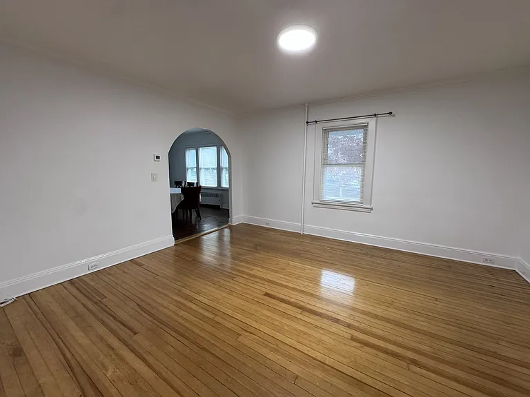 Bright living room leading into dining room
