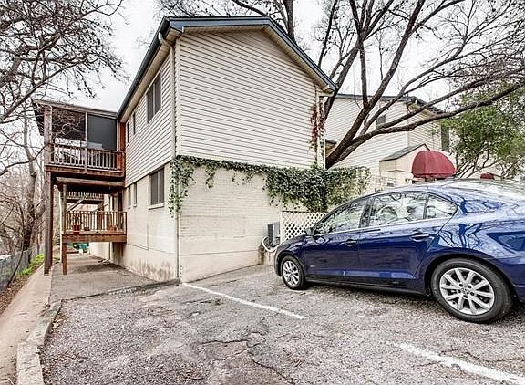 View from the rear. Unit is top level with the screened porch.