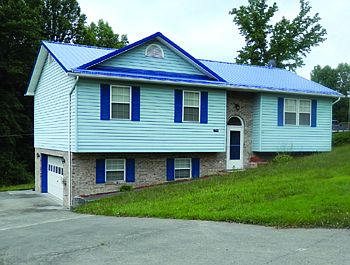 View of Home with Garage