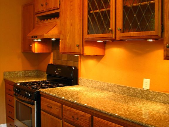 Custom cabinets, granite countertops, stainless appliances