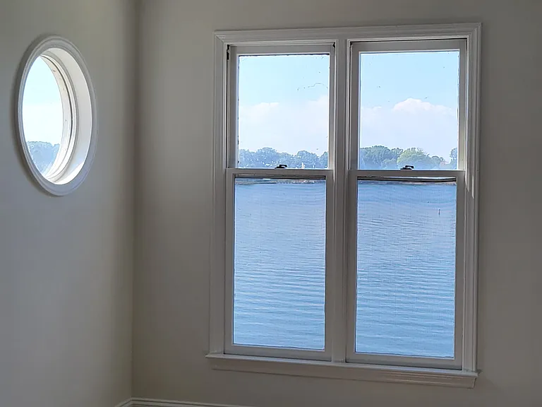 living room with fan and water view, brand new lvp flooring