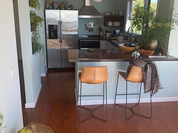 Kitchen with Marble Counter and Stainless Appliances