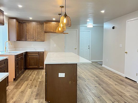 Side view of the kitchen with new Pendant Lights and quartz counters