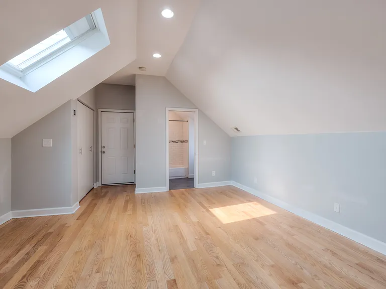 Top floor rear bedroom with skylights