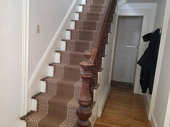 Main stairs and hallway to basement