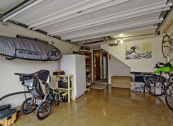 Nicely-finished, one-car attached garage with plenty of equipmen