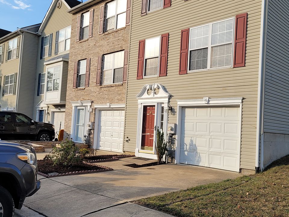 16 Versailles Ct is a 4 BR, 2.5 bath townhouse close to Rt 40 and I-95. 3 parking spaces + garage parking