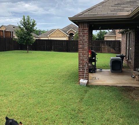 Spacious backyard with patio