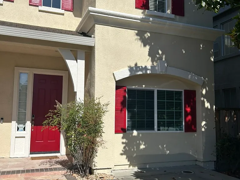 Front of the house, facing east, freshly painted exteriors