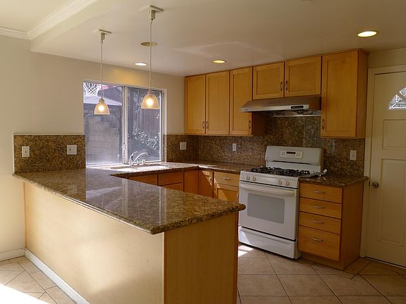 Kitchen with granite counter top and maple cabinets