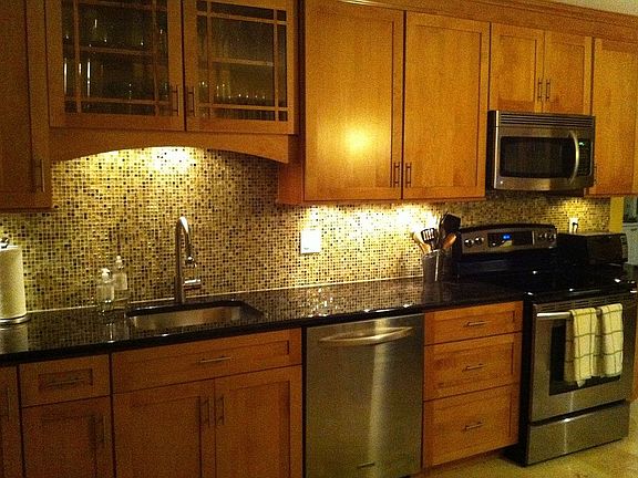 Glass tile backsplash.