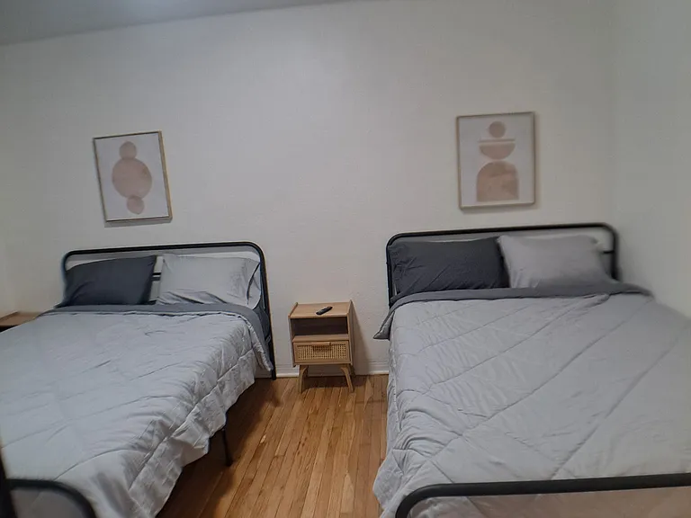 Two very comfortable queen beds with adjacent night tables