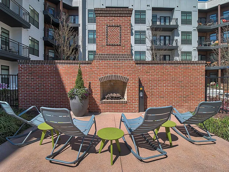 Warm up by the fire at our poolside fireplace